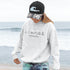 Show off your lake town pride with this cozy Winnipeg Beach Landmark Doodle Hoodie. Featuring a charming, hand-drawn skyline of iconic Winnipeg Beach sights.